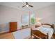 Traditional bedroom with wood furnishings and lots of natural light at 114 Canoe Pole Ln, Mooresville, NC 28117