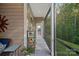 Cozy screened-in porch with greenery views and access to the outdoors at 114 Canoe Pole Ln, Mooresville, NC 28117