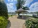 Covered lakeside pavilion with picnic table perfect for community gatherings and waterfront enjoyment at 114 Canoe Pole Ln, Mooresville, NC 28117