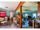Open-concept living room and dining area featuring wood floors and a ceiling fan at 121 C And C Ln, Mooresville, NC 28115
