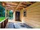 Inviting covered porch features a decorative rug, exterior siding, and a glimpse of the green yard at 121 C And C Ln, Mooresville, NC 28115