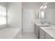 Bathroom featuring double sink vanity, and large tub at 12321 Aquitaine St, Charlotte, NC 28277
