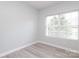Bright bedroom featuring natural light and laminate flooring at 12321 Aquitaine St, Charlotte, NC 28277