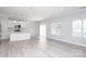 Open concept kitchen with a dining area featuring sleek countertops, stainless steel appliances, and a cozy breakfast bar at 12321 Aquitaine St, Charlotte, NC 28277