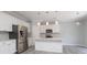 Modern kitchen featuring stainless steel appliances, white cabinetry, and an island with a breakfast bar at 12321 Aquitaine St, Charlotte, NC 28277