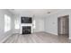 Inviting living room featuring a fireplace, neutral walls, and stylish flooring at 12321 Aquitaine St, Charlotte, NC 28277