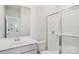 Bright bathroom featuring a glass-enclosed shower, white vanity, and modern fixtures at 142 Satchel Ct, Mooresville, NC 28115