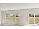 Bright living area with luxury vinyl floors, natural light, and view of yard at 145 Satchel Ct, Mooresville, NC 28115
