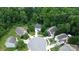 Aerial view of a neighborhood featuring mature trees and well-maintained homes at 1548 Logan Patrick Ct, Gastonia, NC 28052