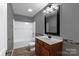 Bathroom with new shower and vanity, a white sink and dark wood cabinets at 1548 Logan Patrick Ct, Gastonia, NC 28052