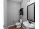 Cozy half bathroom with a clean pedestal sink and classic decor at 1548 Logan Patrick Ct, Gastonia, NC 28052