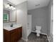 Bathroom with a vanity, a new shower and tub, and gray tile flooring at 1548 Logan Patrick Ct, Gastonia, NC 28052