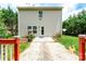 Back exterior view featuring a well-maintained yard and a charming walkway at 1548 Logan Patrick Ct, Gastonia, NC 28052