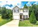 Charming two-story home with manicured lawn and inviting front entrance at 1548 Logan Patrick Ct, Gastonia, NC 28052