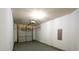 A spacious garage with a gray door and a garage door opener on a white ceiling at 1548 Logan Patrick Ct, Gastonia, NC 28052