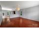 Bright living room featuring gleaming hardwood floors and neutral paint at 1548 Logan Patrick Ct, Gastonia, NC 28052