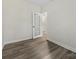Bare bedroom featuring wood-look floors and door leading to another room at 17136 Red Feather Dr, Charlotte, NC 28277