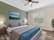 Relaxing bedroom features a blue and green color scheme with large bright window at 17136 Red Feather Dr, Charlotte, NC 28277