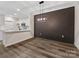Dining area with decorative wall panel and contemporary lighting fixture next to the kitchen at 17136 Red Feather Dr, Charlotte, NC 28277