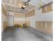 Spacious unfinished garage featuring bare drywall, concrete flooring, and ample space at 17136 Red Feather Dr, Charlotte, NC 28277