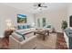Bright living room with wood floors, ceiling fan, and access to a balcony or patio at 17136 Red Feather Dr, Charlotte, NC 28277