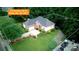Aerial of a home with a manicured lawn, a two-car garage, and mature landscaping at 172 Hunters Hill Dr, Statesville, NC 28677