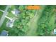 High angle aerial view of a home surrounded by verdant landscaping and a nearby golf course at 172 Hunters Hill Dr, Statesville, NC 28677