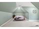 Spacious bonus room features a comfortable bed, eclectic furniture and decor at 172 Hunters Hill Dr, Statesville, NC 28677