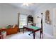 Cozy room features a wooden desk, shelving, and ample natural light from a window at 172 Hunters Hill Dr, Statesville, NC 28677