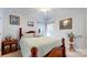 Cozy bedroom with a four-poster bed, soft lighting, and charming decorative touches at 172 Hunters Hill Dr, Statesville, NC 28677
