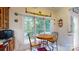 Breakfast nook with a wooden table, metal chairs, and a large window with tree views at 172 Hunters Hill Dr, Statesville, NC 28677
