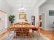 Bright dining area with an elegant chandelier and hardwood floors perfect for Gathering gatherings at 172 Hunters Hill Dr, Statesville, NC 28677