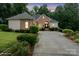 Beautiful single-story brick home with a well-kept lawn and a picturesque dusk backdrop at 172 Hunters Hill Dr, Statesville, NC 28677