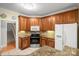 Kitchen with wooden cabinets, granite countertops, stainless steel appliances, and tile backsplash at 172 Hunters Hill Dr, Statesville, NC 28677
