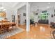 Spacious living room with hardwood floors, natural light, and an open layout to the dining area at 172 Hunters Hill Dr, Statesville, NC 28677