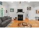 Cozy living room with a fireplace, hardwood floors, and a comfortable seating area at 172 Hunters Hill Dr, Statesville, NC 28677