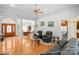 Bright and spacious living room featuring hardwood floors with an open layout and a decorative front door at 172 Hunters Hill Dr, Statesville, NC 28677