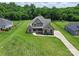 Stunning aerial view of a well-maintained home with lush green lawns at 174 Bellingshire Dr, Mt Ulla, NC 28125