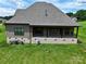 Home's backyard shows the home's roof line and the extensive yard space from an aerial view at 174 Bellingshire Dr, Mt Ulla, NC 28125