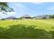 Expansive backyard view showcasing the rear of the house and surrounding properties at 174 Bellingshire Dr, Mt Ulla, NC 28125