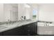 Bathroom with double vanity sinks and a luxurious soaking tub provides a spa-like experience at 174 Bellingshire Dr, Mt Ulla, NC 28125