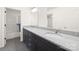 Bathroom vanity with double sinks, granite countertops, and a framed mirror, complemented by modern fixtures at 174 Bellingshire Dr, Mt Ulla, NC 28125