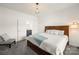 Cozy bedroom features a plush carpet, a comfortable chair and access to the ensuite bathroom at 174 Bellingshire Dr, Mt Ulla, NC 28125