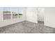 Bright bedroom featuring plush carpeting, natural light from the large window, and an adjoining walk-in closet at 174 Bellingshire Dr, Mt Ulla, NC 28125