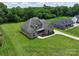 Gorgeous gray home with a large lawn and a covered front porch perfect for relaxing at 174 Bellingshire Dr, Mt Ulla, NC 28125