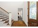 Beautiful foyer featuring hardwood floors, a staircase, and decorative glass accents at 174 Bellingshire Dr, Mt Ulla, NC 28125