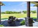 Covered front porch showcasing landscaping, exterior stone accents, and inviting entry at 174 Bellingshire Dr, Mt Ulla, NC 28125