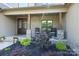 Inviting front porch with decorative plants and seating, enhancing curb appeal at 174 Bellingshire Dr, Mt Ulla, NC 28125