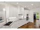 Modern kitchen with white cabinets, stainless steel appliances, and granite countertops at 174 Bellingshire Dr, Mt Ulla, NC 28125