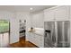 This bright kitchen boasts stainless steel appliances, granite countertops, white cabinets and a pantry at 174 Bellingshire Dr, Mt Ulla, NC 28125